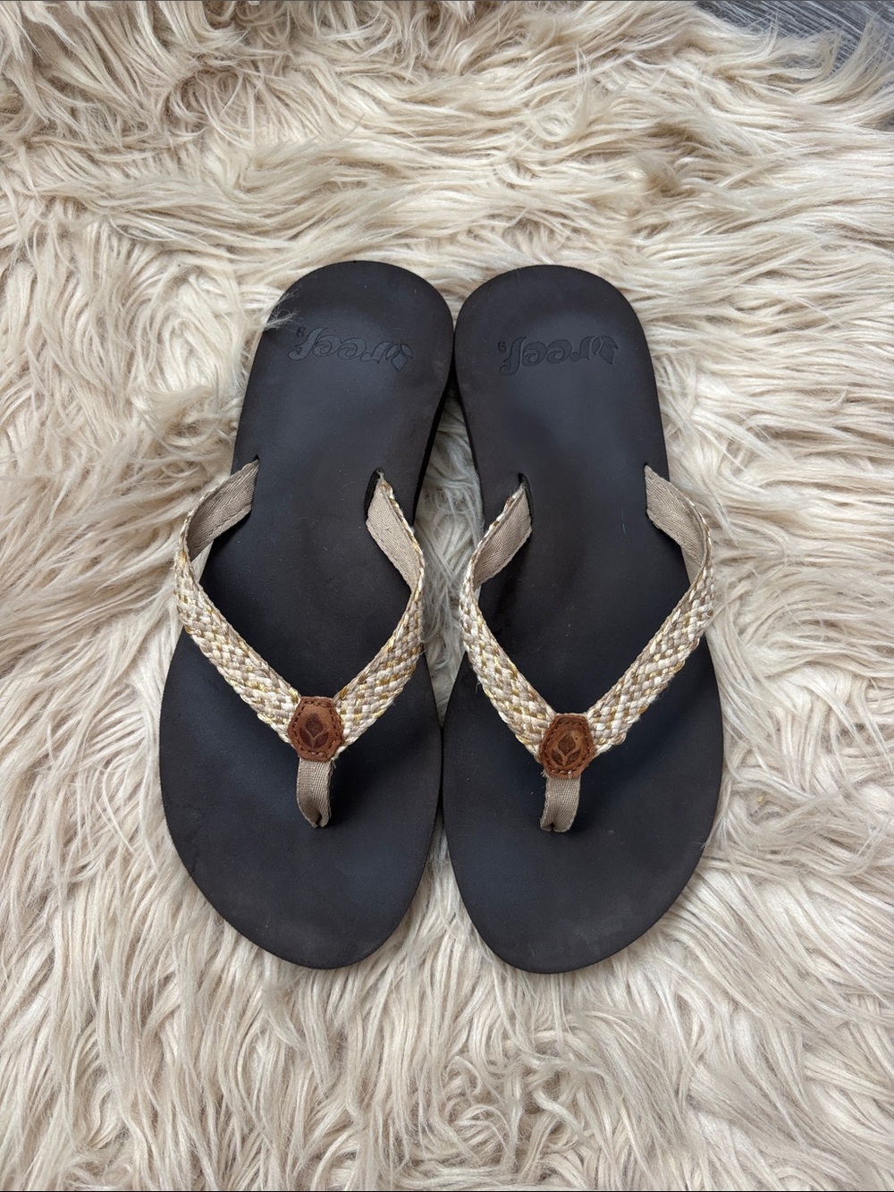 Reef Black Footbed Flip Flops with Beige Braided Straps and Brown Accent